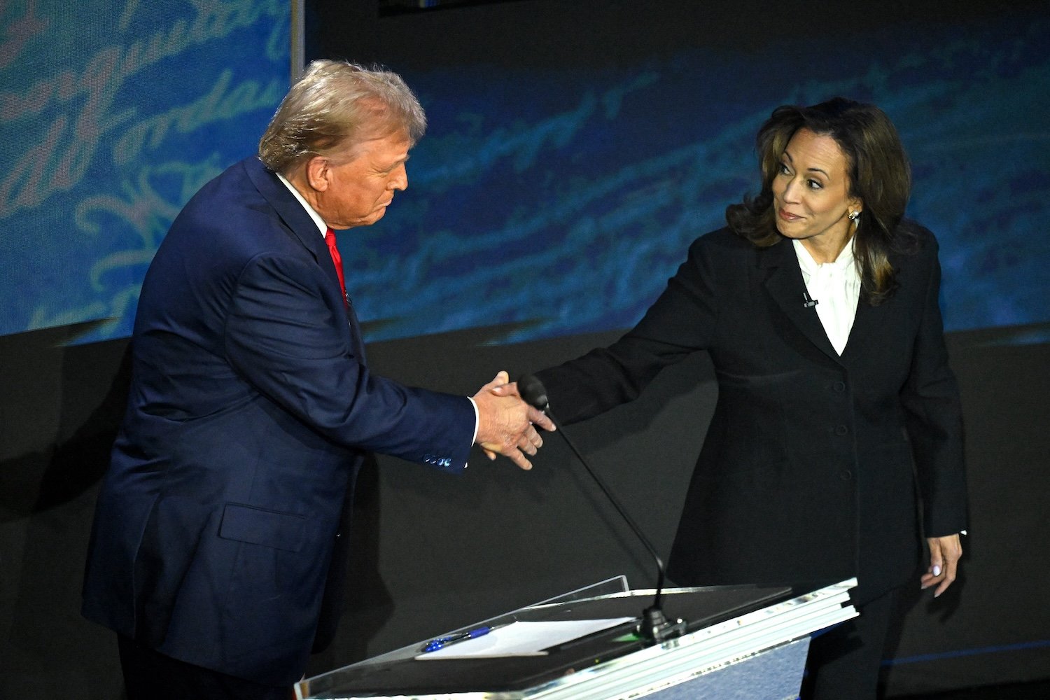 Kamala Harris (R) shakes hands with former US President and Republican presidential candidate Donald Trump during a presidential debate at the National Constitution Center in Philadelphia, Pennsylvania, on September 10, 2024.