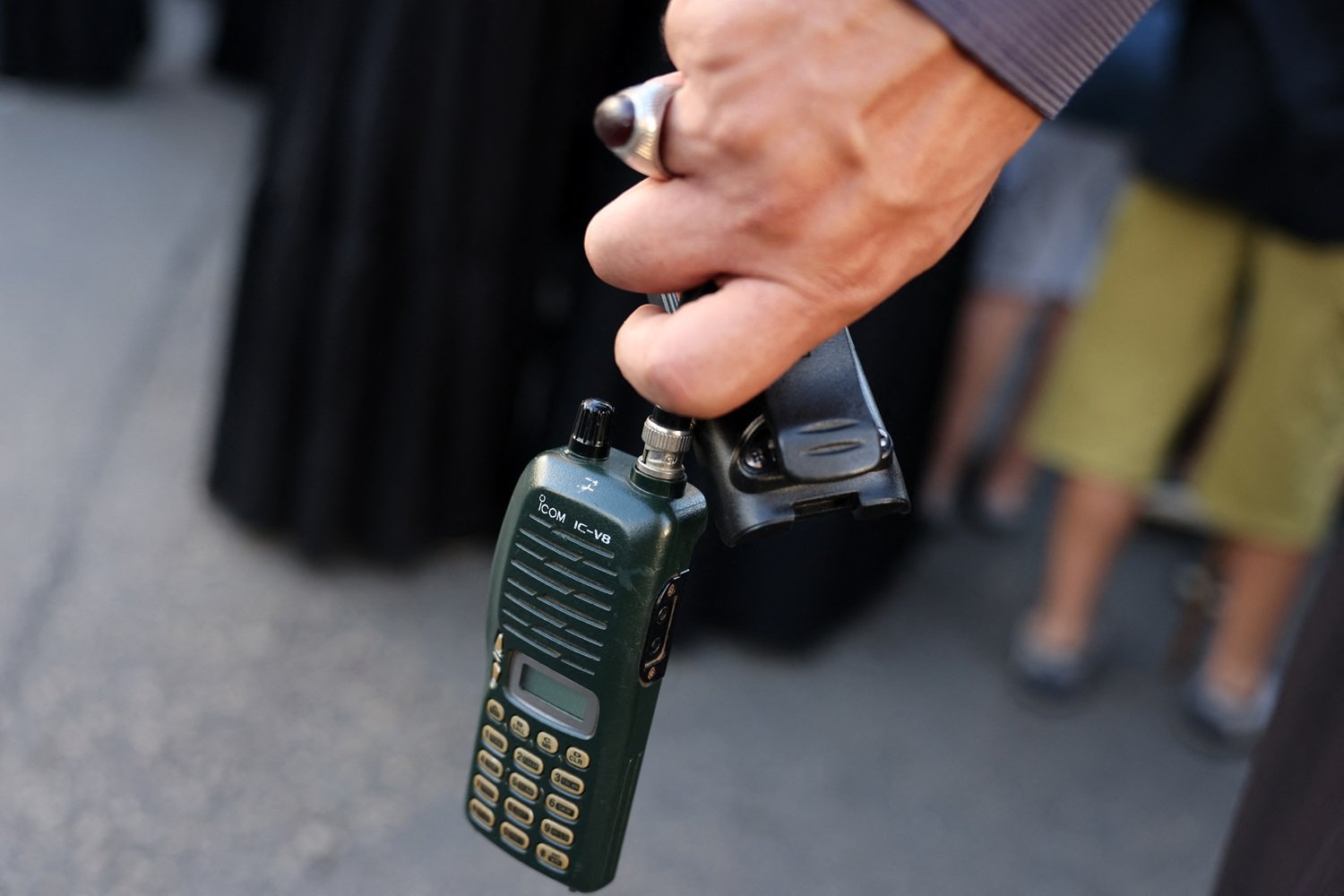 A man holds a walkie talkie device after he removed the battery during the funeral of persons killed when hundreds of paging devices exploded in a deadly wave across Lebanon the previous day, in Beirut's southern suburbs on September 18, 2024. Hundreds of pagers used by Hezbollah members exploded across Lebanon on September 17, killing at least nine people and wounding around 2,800 in blasts the Iran-backed militant group blamed on Israel.